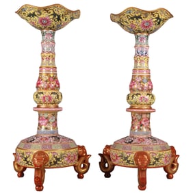 A pair of enamel oil lamps with yellow ground and gilded lotus.