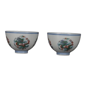 Blue and white porcelain cup with dragon and chicken heart design