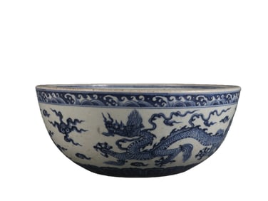 Blue and white porcelain bowl with dragon and cloud design