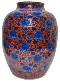 Iron-red and blue-and-white lotus scroll pattern jar