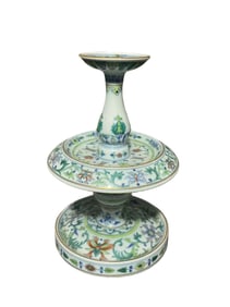 A pair of doucai (enamel overglaze) candlesticks with lotus and floral patterns