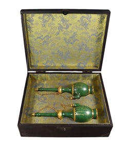 A pair of Hetian jade vases with gold plating and engraving