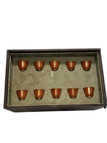 A set of iron-red and gold-painted double happiness cups