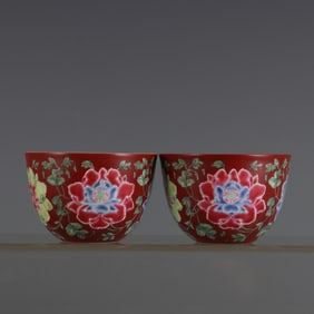 A pair of coral red enamel peony patterned jars and cups