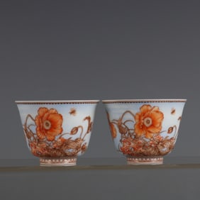 A pair of iron-red enamel poppy pattern cups