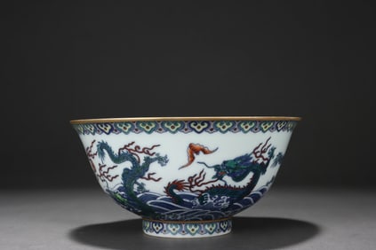 Doucai (enamel overglaze) bowl with dragon and sea wave design