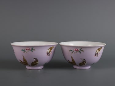 A pair of enamel-painted bowls depicting the Nine Peacees (a mythical creature symbolizing good