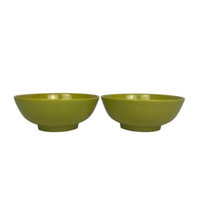 A pair of lemon yellow cups