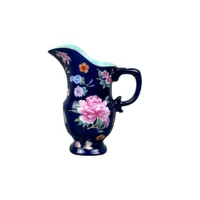 Sapphire blue ground with enamel flowers, flower pot and watering can