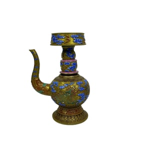 A carved gold-plated water pitcher with waves, auspicious clouds, and mythical beast patterns