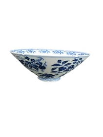 Blue and white porcelain bowl with floral and fruit design