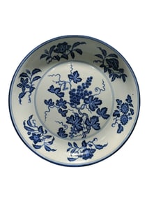 Blue and white porcelain plate with floral and grape motifs