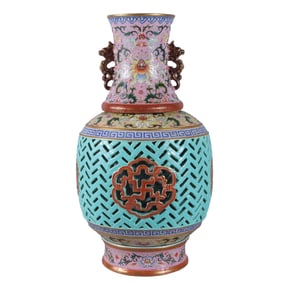 A revolving vase with a yellow background and openwork design (inner liner depicting a dragon boat