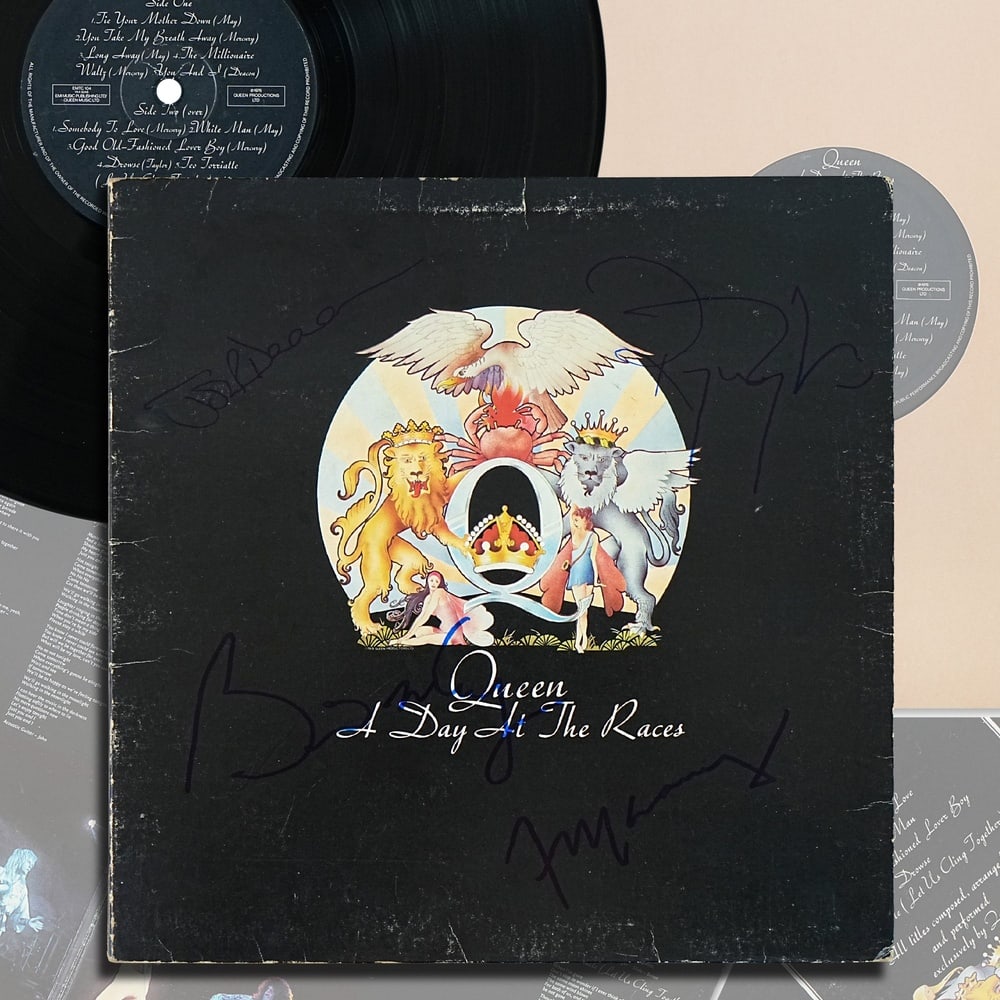 QUEEN FULLY SIGNED "A DAY AT THE RACES" LP (UK FIRST PRESSING): 12 1/4 x 12 1/4 in Queen stands among the most influential rock bands in modern music history, defined by their unparalleled fusion of theatricality, virtuosity, and songwriting ambition. Formed in Lo