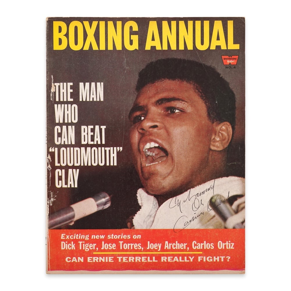 MUHAMMAD ALI / CASSIUS CLAY SIGNED "BOXING ANNUAL" MAGAZINE - DUAL SIGNATURE EDITION: 10 7/8 x 8 1/4 in (27.8 x 21.4 cm) Provenance and Authentication: This collectible has undergone a rigorous forensic evaluation. The signatures were carefully analyzed across multiple criteria, includ