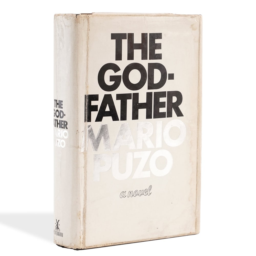 MARIO PUZO SIGNED THE GODFATHER: 8 5/8 x 5 7/8 in (22 x 14.8 cm) Provenance and Authentication: According to the Letter of Authenticity (LOA) and Certificate of Authenticity (COA) provided by the consignor, this collectible was
