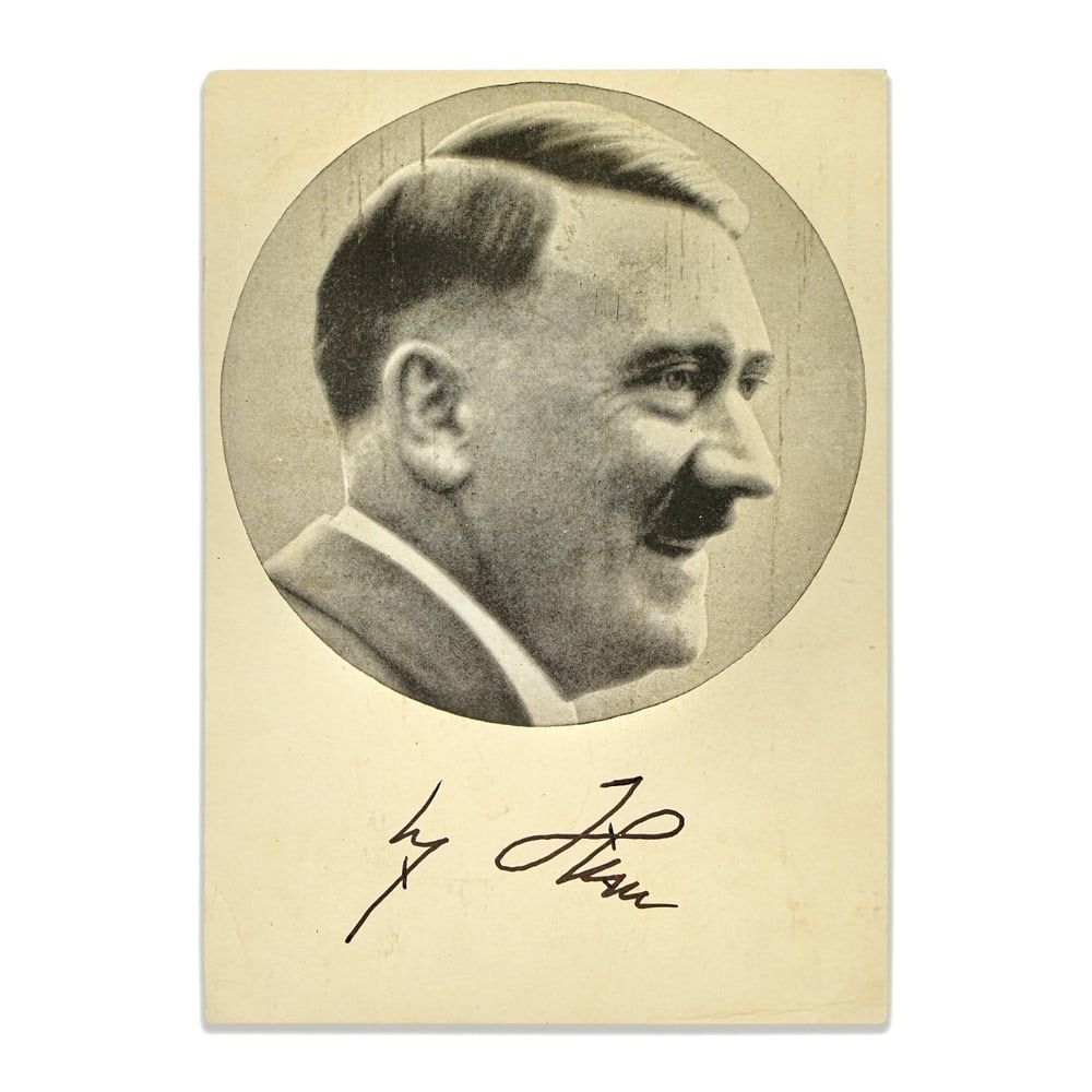 ADOLF HITLER SIGNED PORTRAIT POSTCARD: 5 7/8 x 4 1/4 in (14.8 x 10.7 cm) Provenance and Authentication: According to the Letter of Authenticity (LOA) and Certificate of Authenticity (COA) provided by the consignor, this collectible was