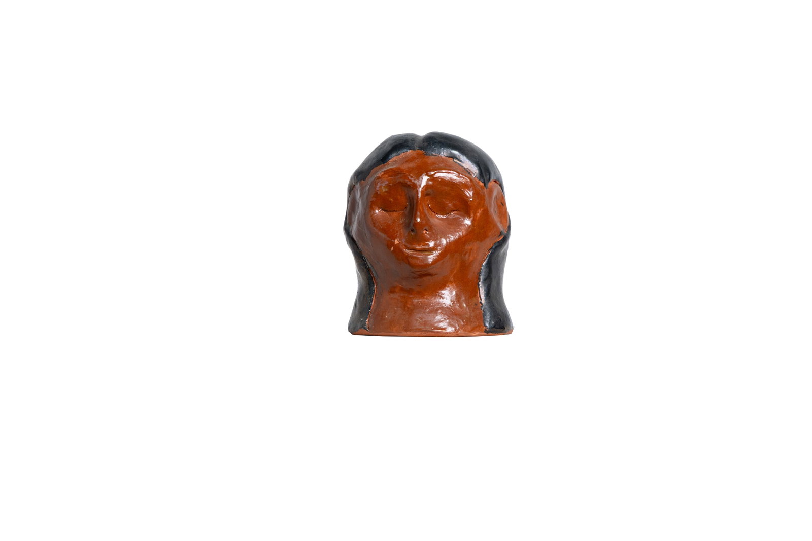 Folk Art Terracotta Head with Black Hair Glaze: Hand-formed terracotta head with closed eyes and dark hair glaze. Approx. 5.25" tall and 4.25" diameter.Size is measured and written on the back of the painting or next to each object. The first size 