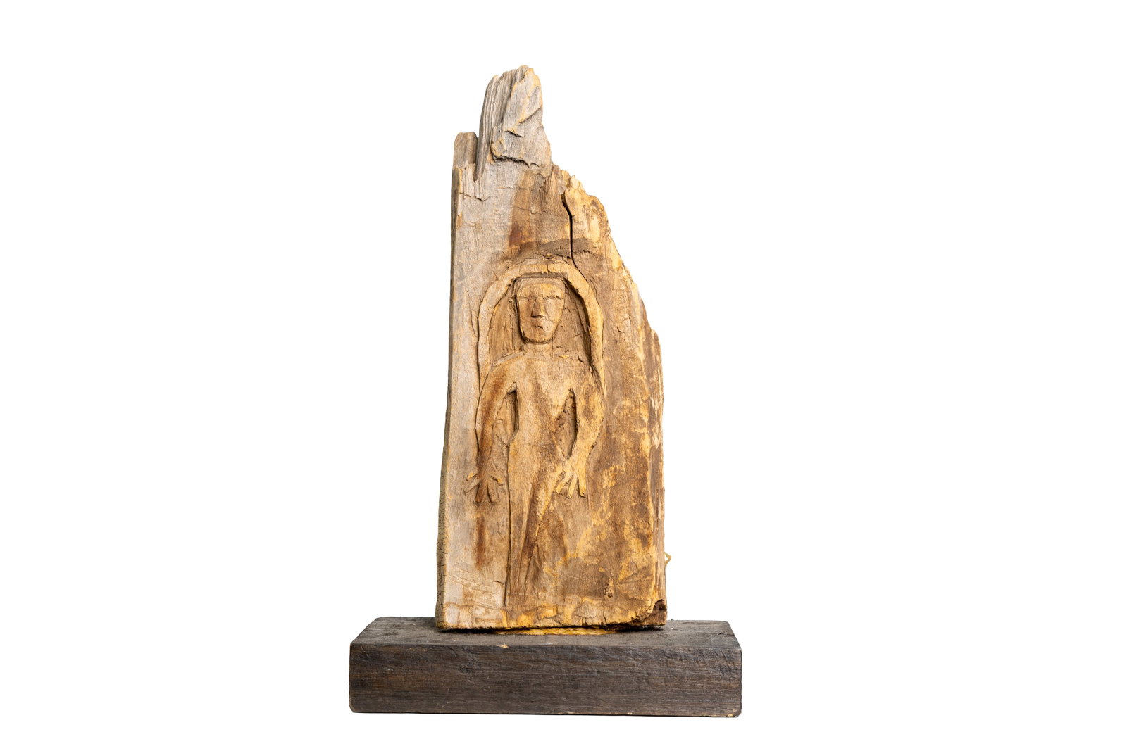 Primitive Carved Wood Sculpture Figure in Weathered Wood Slab: Carved figure emerging from a naturally weathered wood fragment on a base. Approx. 16.75" tall, 9.75" wide, 5.75" deep.Size is measured and written on the back of the painting or next to each object. 