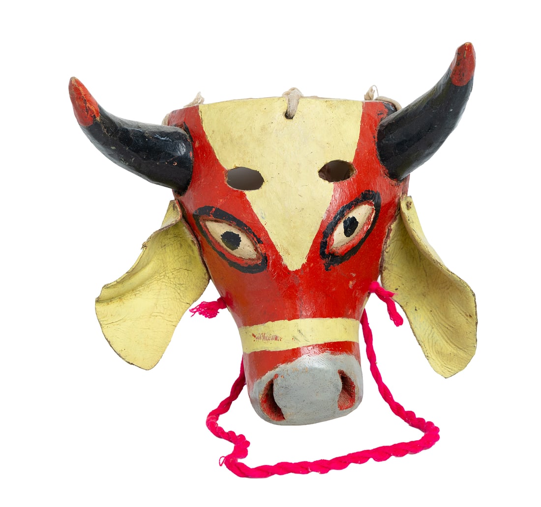 Painted Red and Yellow Bull Mask: Brightly painted bull mask in red, yellow, and black with rope ties. Great wall display piece. Measuring: 10" x 11" wide x 4" deep. Size is measured and written on the back of the painting or next to