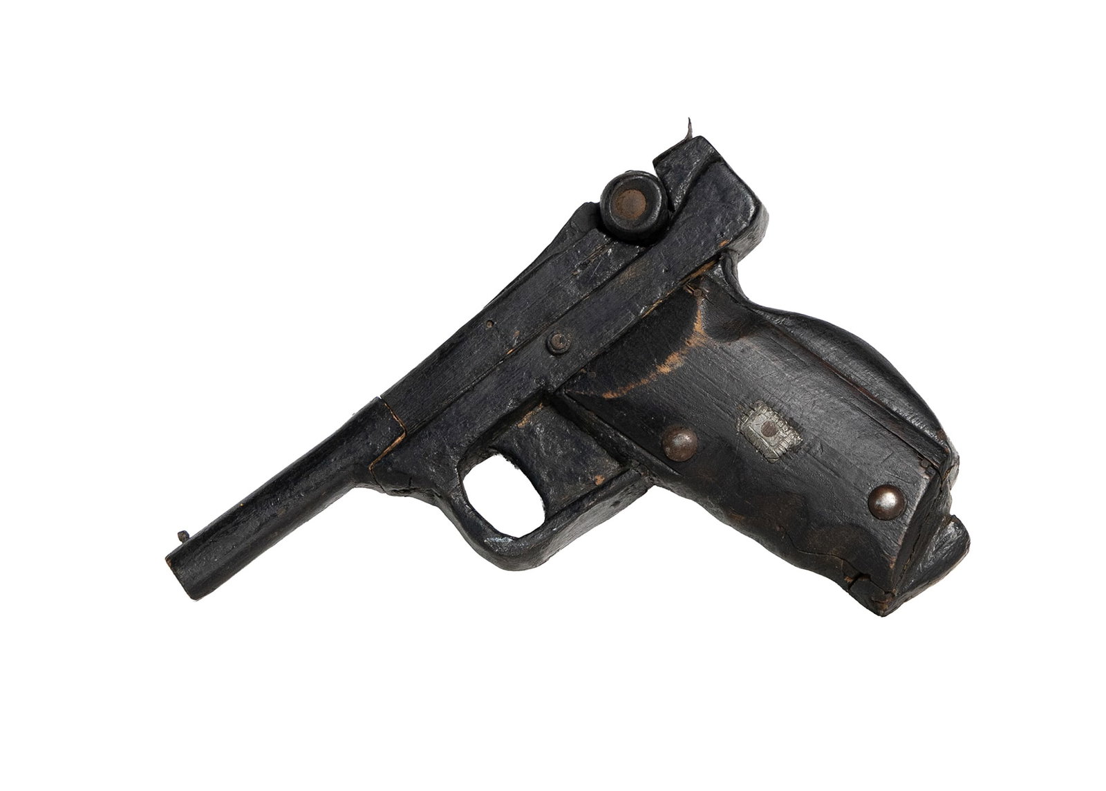 Vintage Handmade Wooden Toy Pistol – Folk Art Black Painted Gun: Handmade folk-art toy pistol crafted from wood and painted in black, showing charming wear and authentic age. Metal tacks and hardware hold the body together, giving it a rugged frontier look. A chara