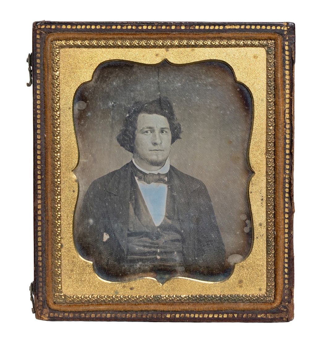 19th-Century Daguerreotype Portrait of a Gentleman in Original Case: This antique daguerreotype features a formally dressed gentleman, captured in the mid-19th century with the characteristic soft clarity and reflective depth of early photography. The portrait is house