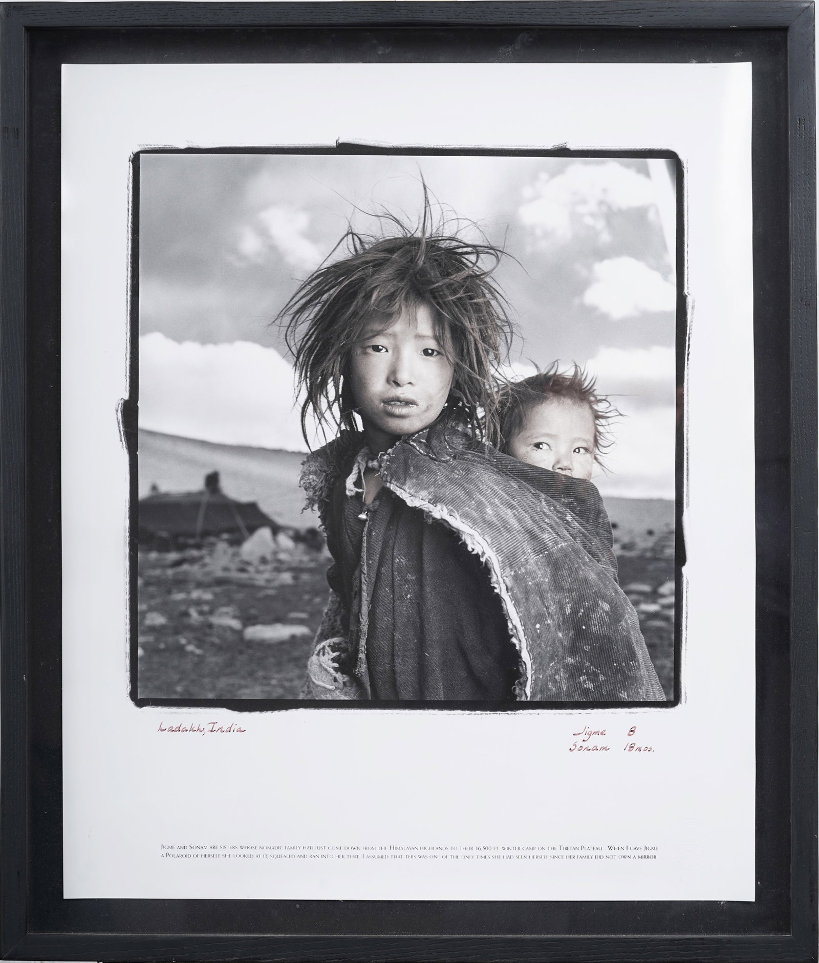 Phil Borges (b. 1948) Jigme and Sonam Himalayan Documentary Portrait Print: Framed vintage American photography print. Measuring: 27 by 23 inches overall, and 16 by 16 painting alone. Please see all images for condition. Size is measured and written on the back of the paintin