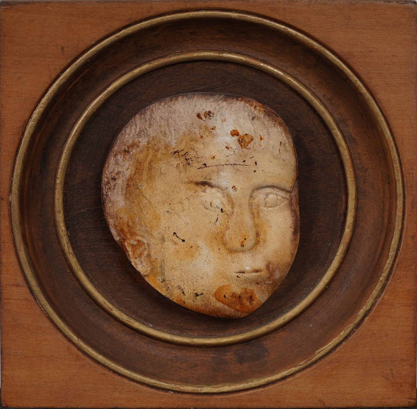 Antique American Folk Art Carved Wood Baby Head Mounted on Wood Frame: Framed antique American carved wood folk art. Measuring: 7 by 7 inches overall, and 6.25 by 6.25 painting alone. Please see all images for condition. Size is measured and written on the back of the pa