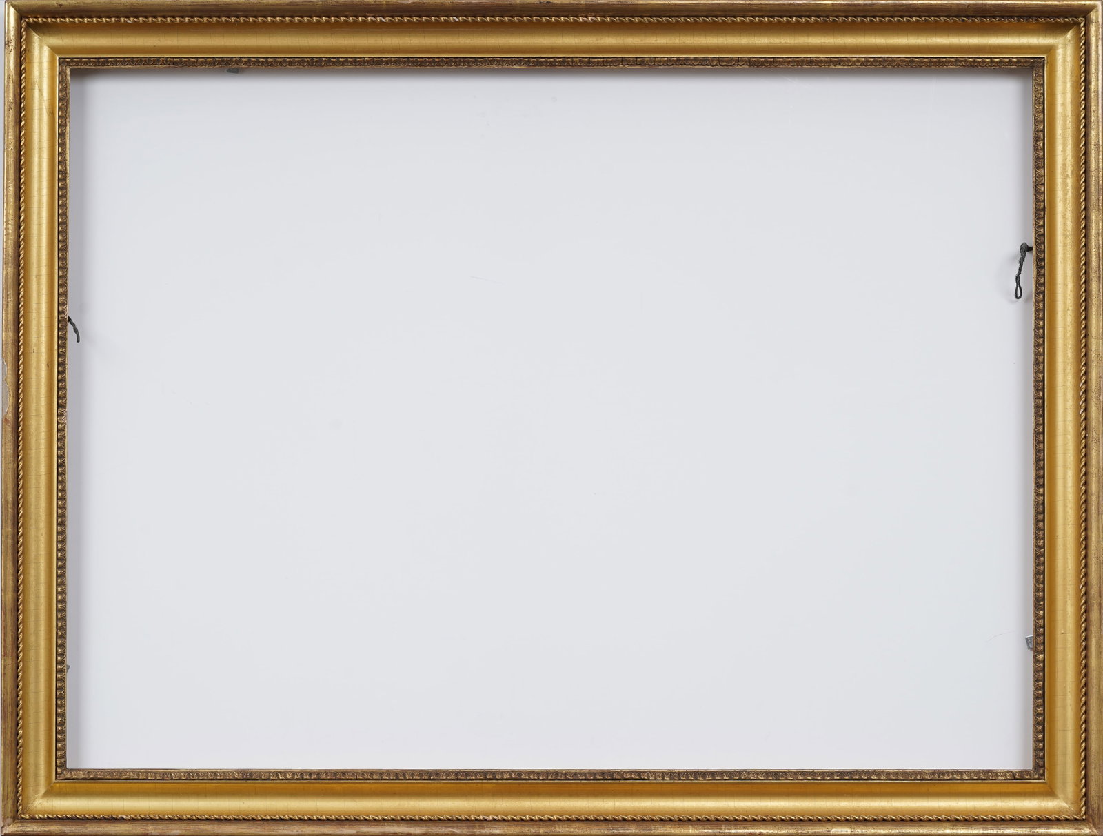 Antique Gilded Flat Cove and Rope Trim Oil Painting Frame Fits 48" x 34.5": Antique gilded oil painting frame. Measuring: 52.5 by 39.5 inches overall, 48 by 34.5 rabbet size, and 46.75 by 33.25 sight size. Please see all images for condition. Size is measured and written on t