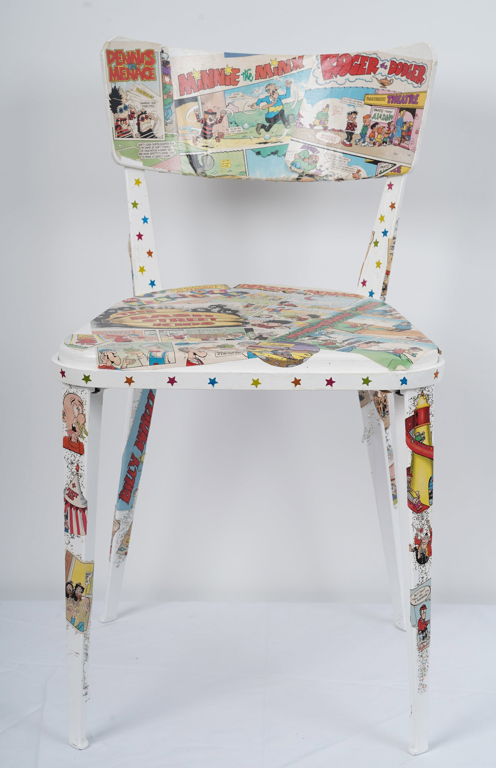 Jasmine Guiness "Beano Bonanza" Contemporary Mixed Media Chair Assemblage: Contemporary American mixed media chair. Measuring: 31 by 18 by 18 inches overall. Please see all images for condition. Size is measured and written on the back of the painting or next to each