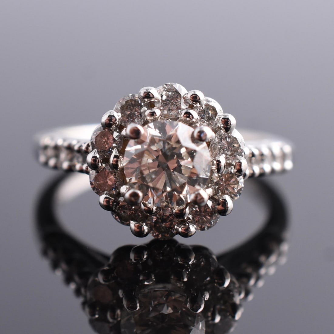 18k White Gold 2ctw Natural Diamond Halo Ring: 18k White Gold | Approximate Weight: 5.5g | Diamond | Size 6 1/2 | Piece is marked "18k". Center stone is estimated to weigh approximately 0.9ct and measures 6mm diameter x 4mm tall. Domestic flat