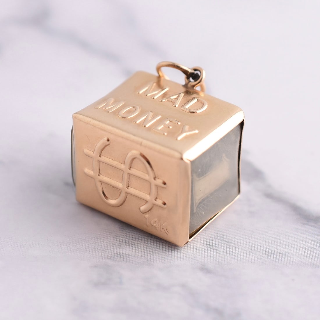 14k Yellow Gold Vintage "Mad Money" Pendant: 14k Yellow Gold | Approximate Weight: 3.4g | 5/8" Wide x 1/2" Tall | Piece is marked "14k".Domestic flat rate shipping with Fedex is set to $45 plus insurance for this lot. Metals and stones are
