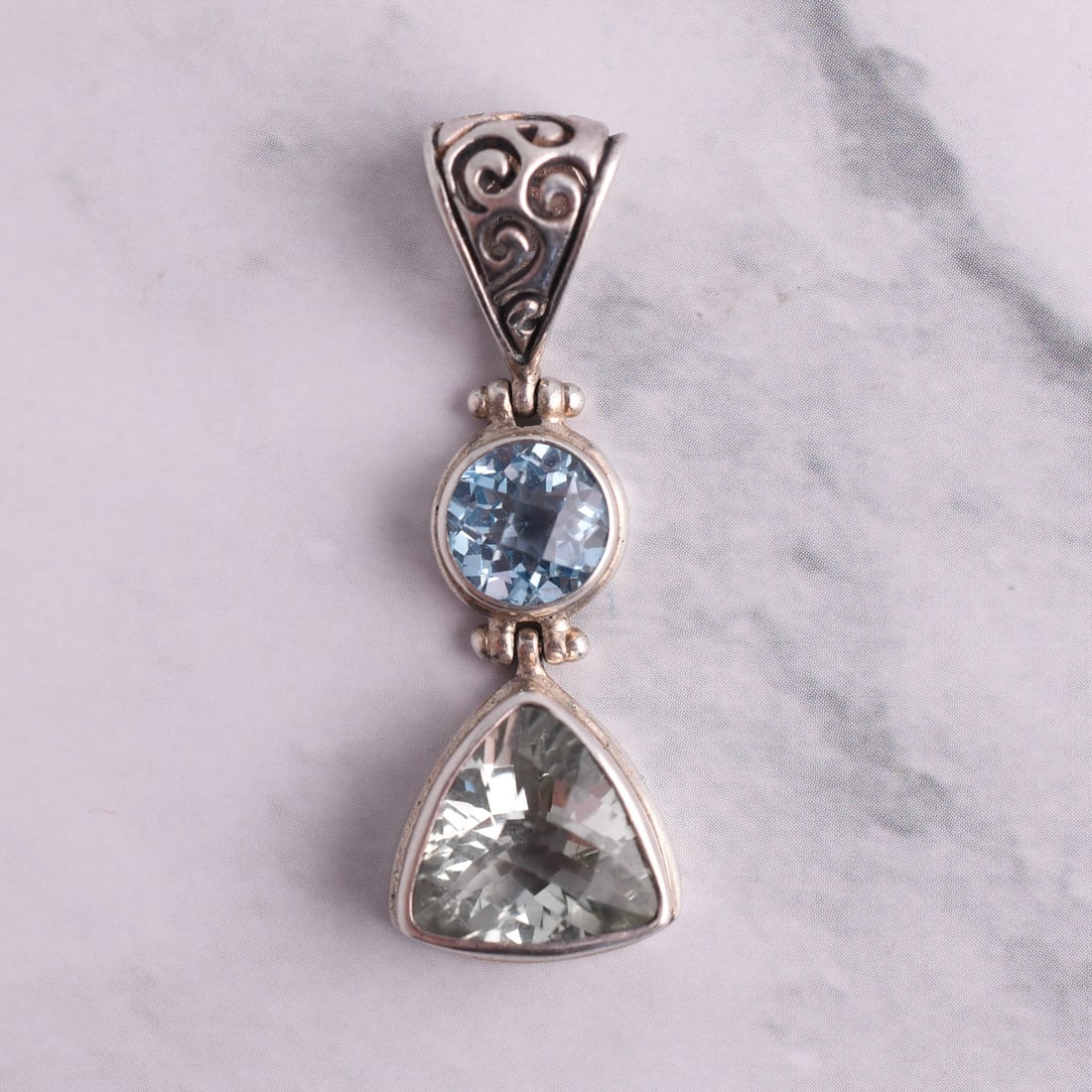 Natural Green Amethyst & Blue Topaz Sterling Silver Pendant: Sterling Silver | Approximate Weight: 5.6g | Green Amethyst & Blue Topaz | 1/2" Wide x 1 5/8" Tall | Piece is marked "925". Domestic flat rate shipping with Fedex is set to $45 plus insurance for