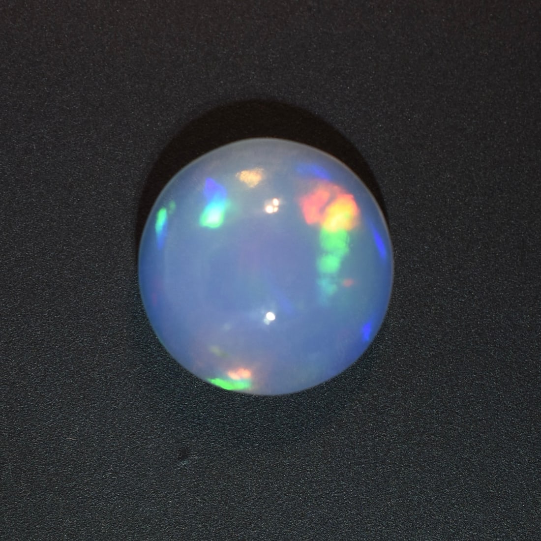 3.0ct Natural Fire Opal Cabochon: Size: 11mm Diameter | Appears be be unheated. Domestic flat rate shipping with Fedex is set to $45 plus insurance for this lot. Metals and stones are guaranteed. Please see all images for condition Fo