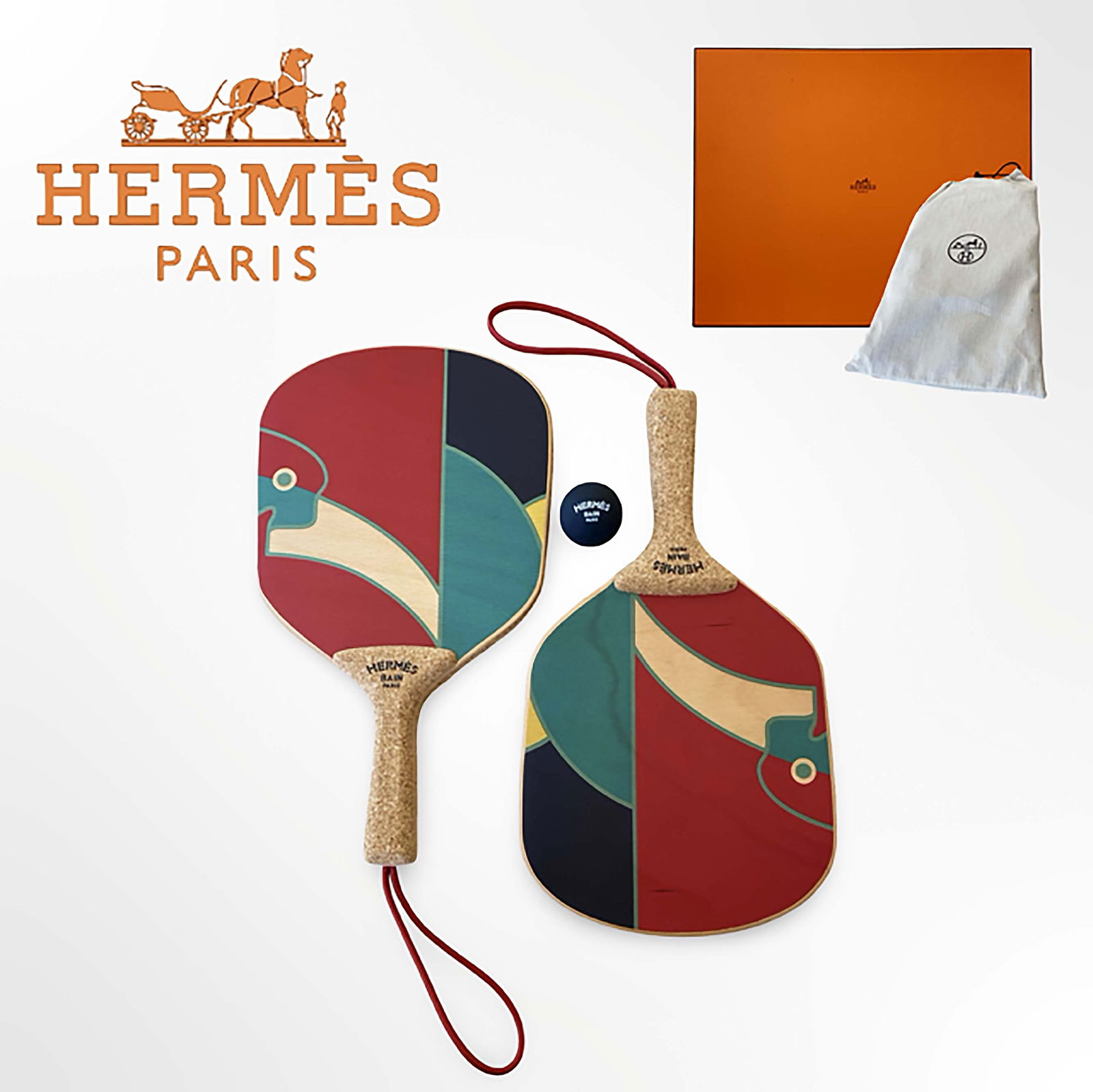 A Hermes Jeux D'Animaux Paddle Ball Set W/ Original Box: A French Hermes Jeux D'Animaux Paddle Ball Set in Red Black and Green. Cork Handles and Official Hermes Bain Paris Rubber. Approx. Measurements: H 15.5" x W 8.9"