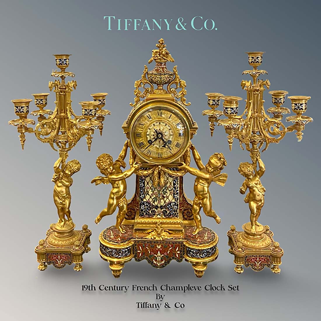 19th C. French Tiffany & Co. Champleve Enamel Bronze Clock Set, Hallmarked: 19th Century French Tiffany & Co. Champleve Enamel Bronze Clock Set, Hallmarked. Clock: H 19" x L 10.25" x W 4.75", Candelabras: H 17.5" x W 9"
