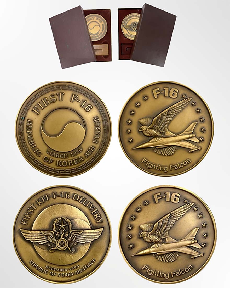 A Lot of Two Rare South Korean Air Force F-16 Commemorative Bronze Medals: A Lot of 2 Rare South Korean Air Force F-16 Commemorative Bronze Medals by Medallic Art Company 1986-1994. Diameter for Each Medal 3" (76 mm). Presentation Box size: H 1" x L 6" x W 4". Description: T