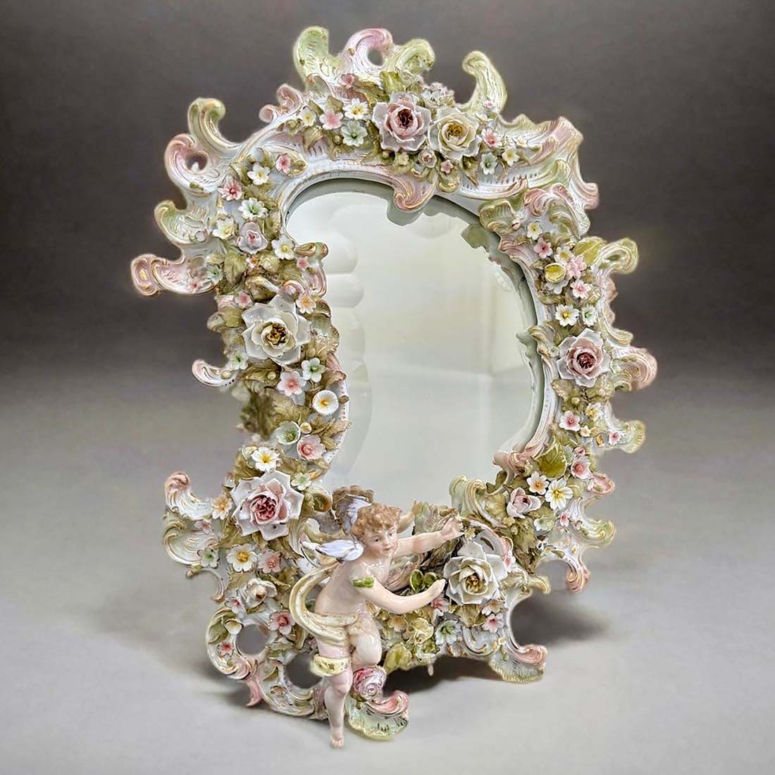 A Royal Vienna Hand Painted Porcelain Figural Wall Mirror: An Austrian Royal Vienna Hand Painted Porcelain Wall Mirror. 16" x 11"