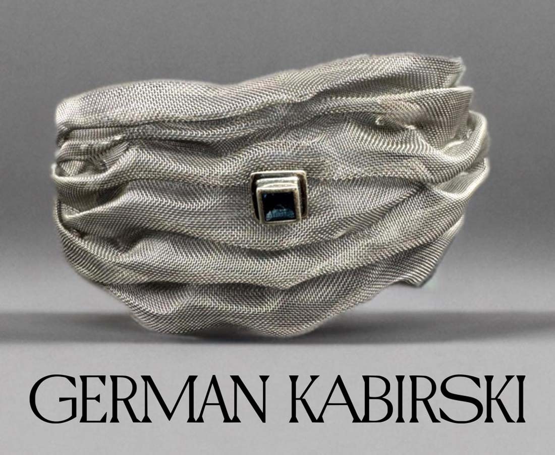 A German Kabirski 925 Silver Soft Fibrex Titanium Mesh Blue Topaz Bracelet: A German Kabirski 925 Silver Soft Fibrex Titanium Mesh Princess-Cut Blue Topaz Bracelet.