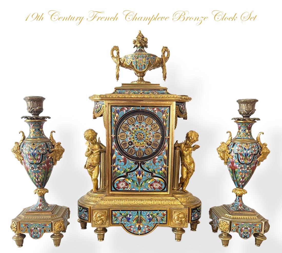 19th C. French Napoleon III Champleve Figural Gilt Bronze Clock Set: 19th C. French Napoleon III Champleve Enameled Figural Gilt Bronze Clock Set. Clock: H 17" x L 10.5", Candelabras: H 12" x D 4"