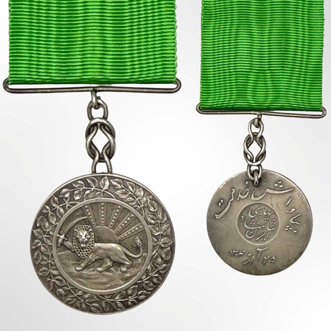 A Rare Persian Pahlavi 1925 Meritorious Service Honor Authentic Silver Medal: ?IRAN: Silver Medal of the Order of Homayoun for Meritorious Service from the Pahlavi Dynasty, circa 1925 by Arthus Bertrand Paris. Full Length 4.25" x Diameter 1.4" (35 mm). Description: Rare and Aut