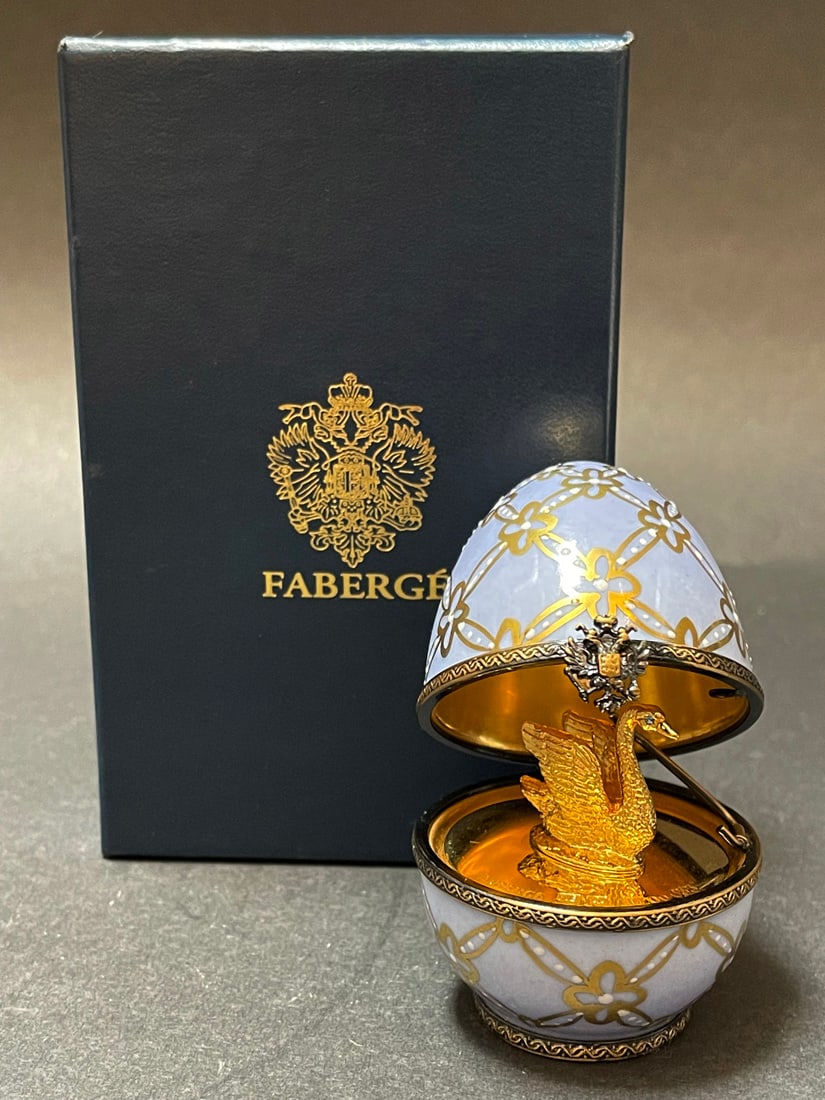 A Faberge Imperial Sterling & Limoges Porcelain Swan Egg, Numbered & Boxed: A Faberge Imperial Sterling & Limoges Porcelain Swan Egg, Limited Edition, Numbered #525 & Boxed. 2.5" x 3" H