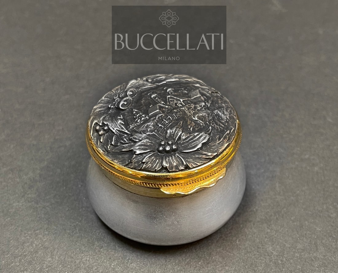 A BUCCELLATI STERLING SILVER CHRISTMAS THEME PILL BOX, HALLMARKED: A BUCCELLATI STERLING SILVER PILL BOX IN HIGH RELIEF WITH CHRISTMAS THEME MOTIF. HALLMARKED. 2" D x 1.5"