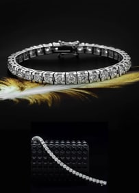 An Exquisite Round Brilliant Cut Diamonds & 18K Gold Bracelet