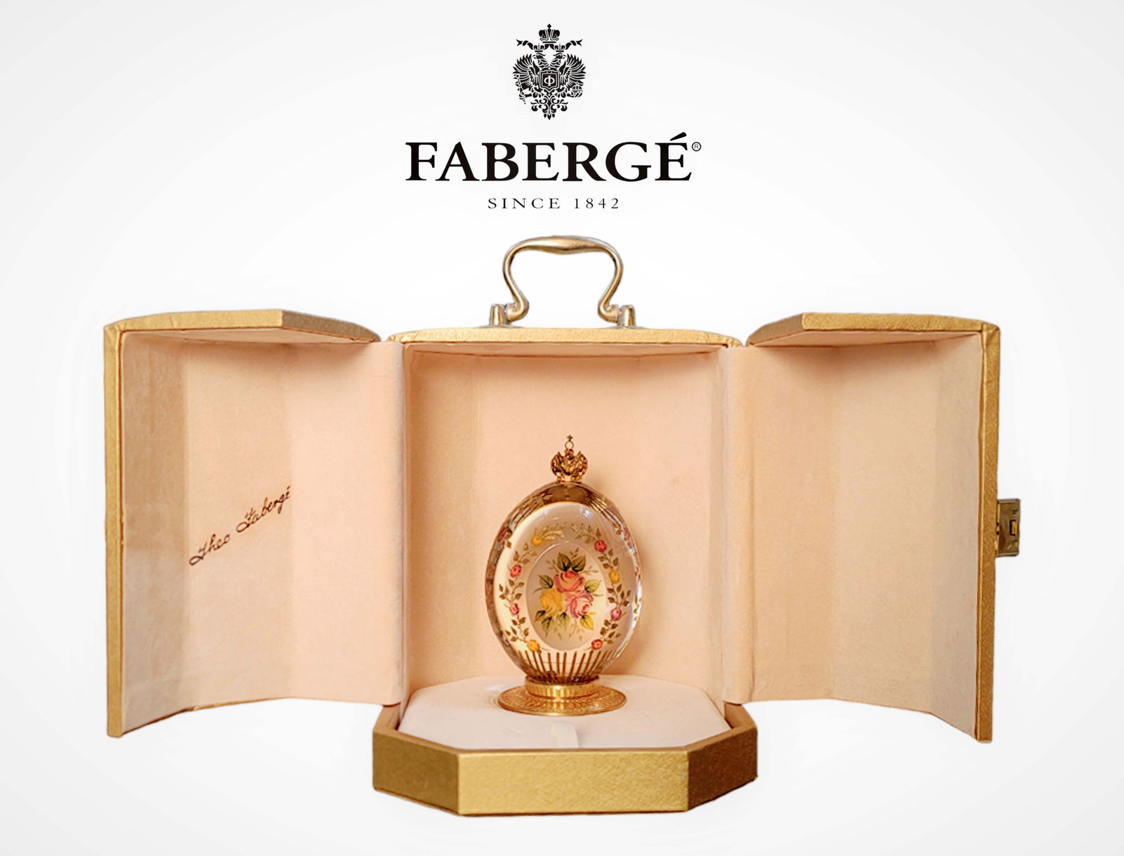 The Rose Garden Egg 1994, A Theo Faberge Limited Edition Crystal Decorative Egg, Boxed: The Rose Garden Egg 1994, A Theo Faberge Limited Edition Crystal Decorative Egg with original box, Hallmarked and numbered #104. (H 5.25"). The Rose Garden Egg delicately portrays a bouquet of roses h