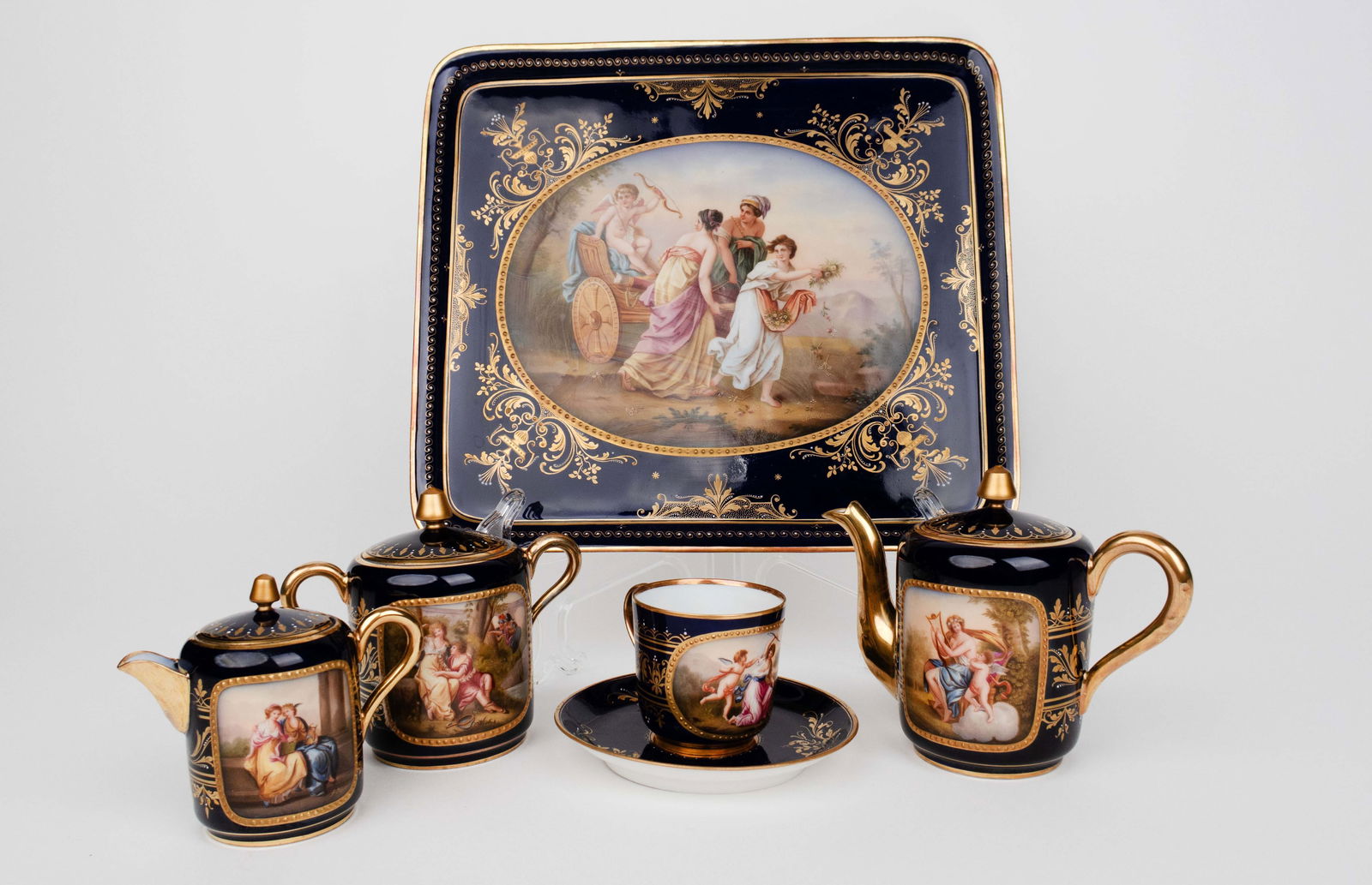 19th C. Royal Vienna Hand Painted Cobalt Porcelain Tea Set, Hallmarked: 19th C. Austrian Royal Vienna Hand Painted Cobalt Porcelain Tea Set. Signed. Tray: 12" x 10", Tallest piece: H 5"