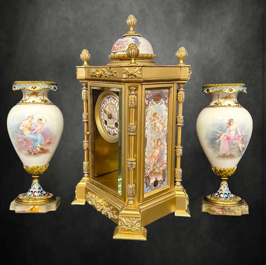19th C. TIFFANY & Co. Sevres Champleve Bonze Clock Set: 19th C. French TIFFANY & Co. Sevres Hand Painted signed porcelain Champleve Enameled Bonze Clock Set. Clock: 13" H x 7" x 7.5", Vases: 6" H x 3" x 3.25"