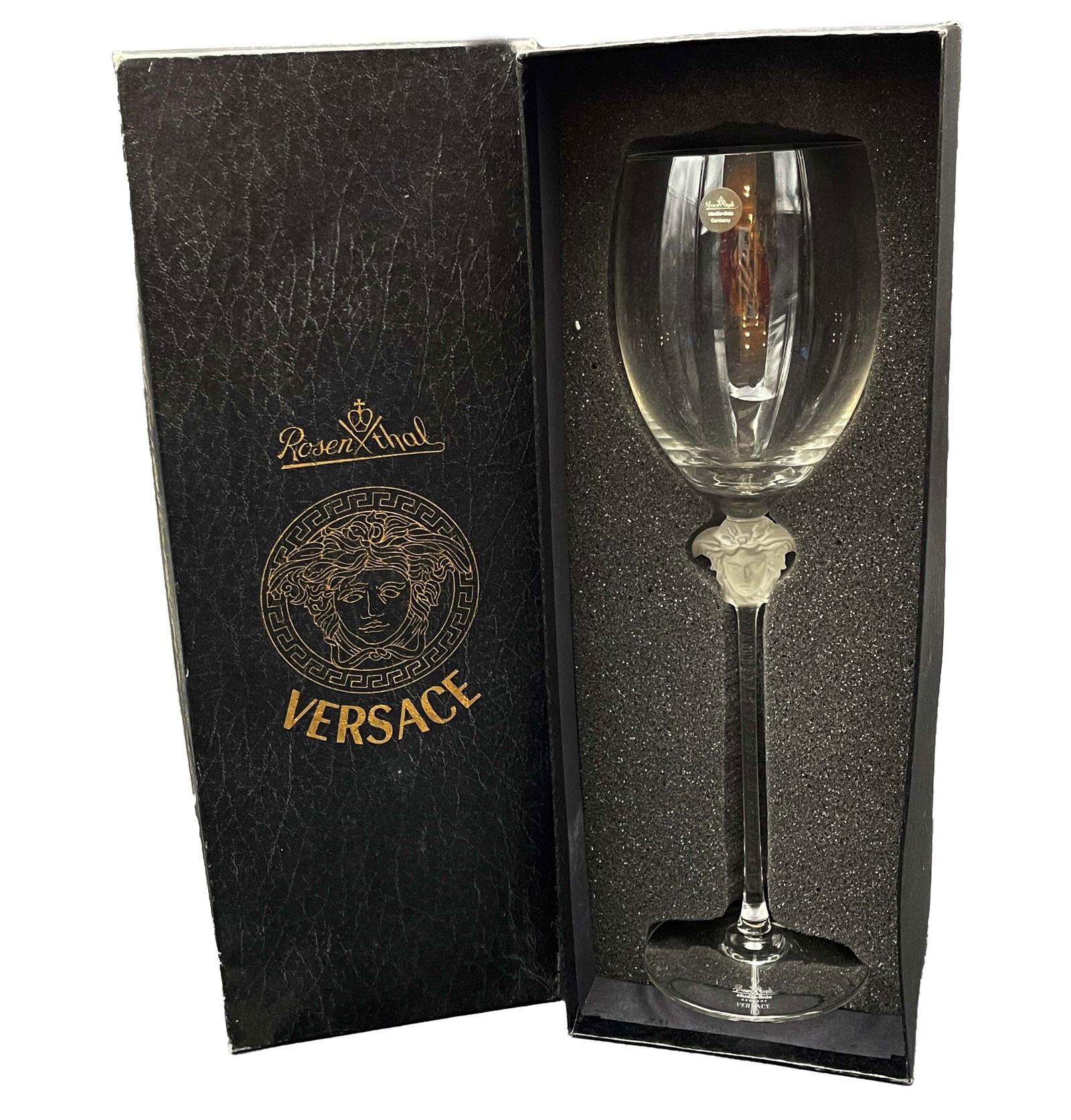 MEDUSA LUMIERE, A VERSACE WATER GOBLET / WINE GLASS BY ROSENTHAL: MEDUSA LUMIERE, A VERSACE WATER GOBLET / WINE GLASS BY GERMAN ROSENTHAL, SIGNED, COA, BOXED. Glass: 12" H x 3.5" x 3.5", Box: 14" x 5" x 5"