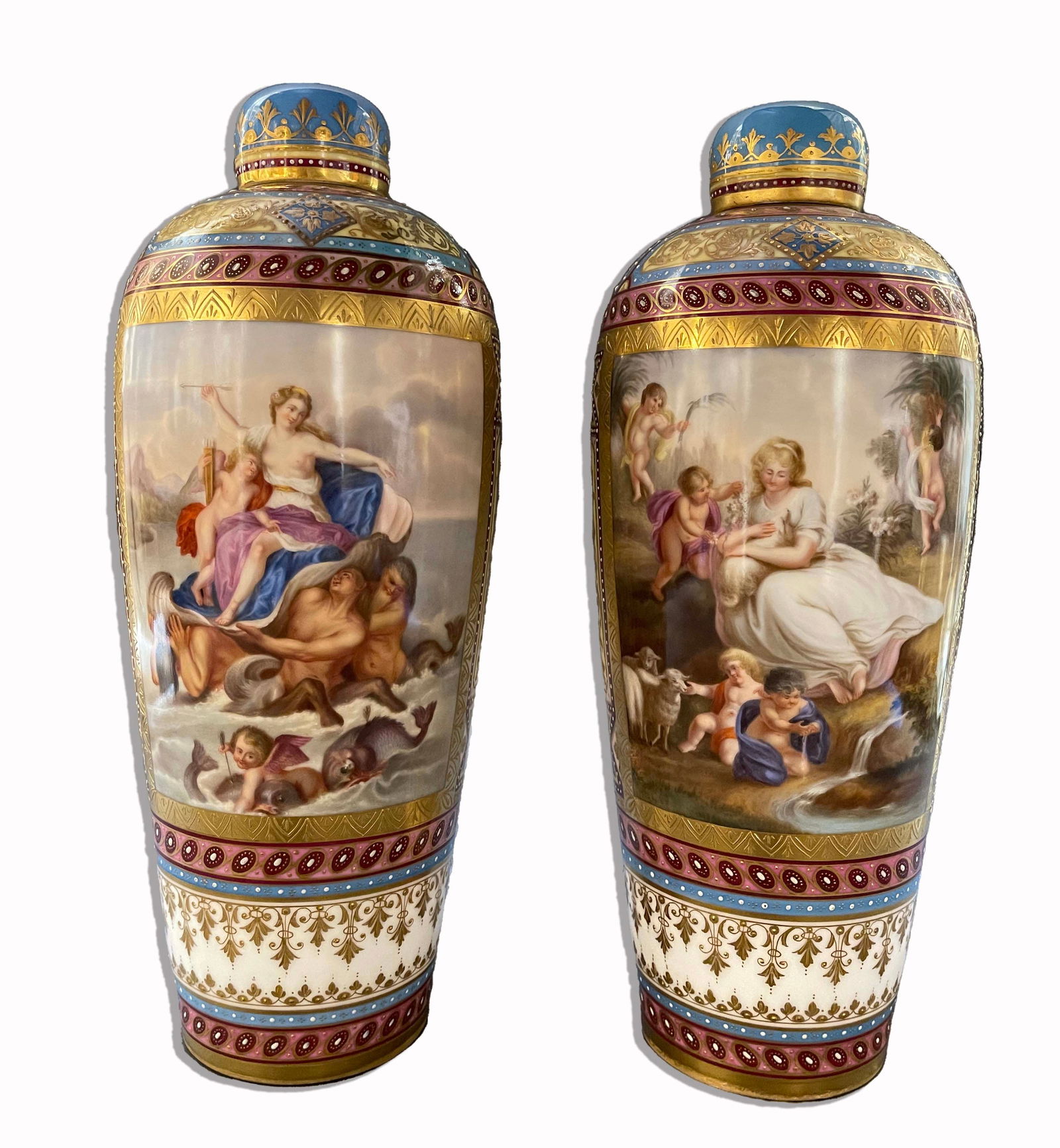 A Pair Of 19th C. Hand Painted Jeweled Royal Vienna Lidded Vases: A Pair Of 19th C. Hand Painted Porcelain Jeweled Royal Vienna Lidded Vases. Hallmarked. H 12" x 4.75" x 4.75"