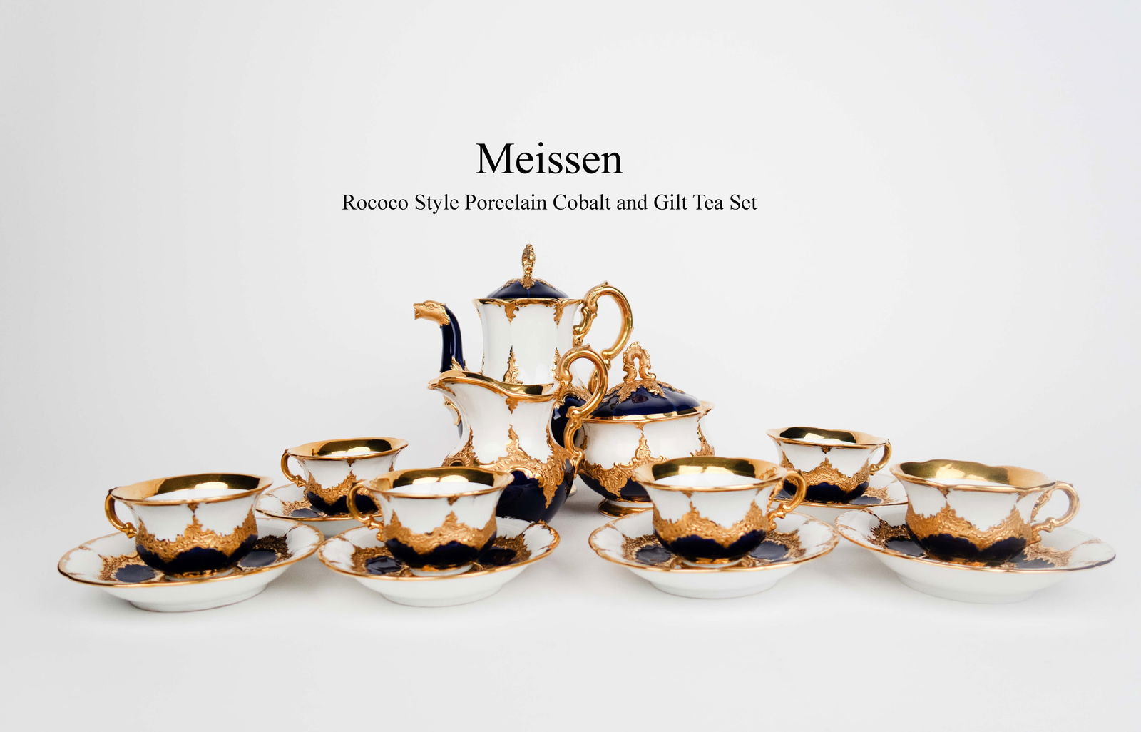A 20th C. German Meissen Rococo Style Cobalt & Gilt Porcelain Tea Set: A 20th C. German Meissen Rococo Style Cobalt & Gilt Porcelain tea set, hallmarked. Taller piece: H 8"